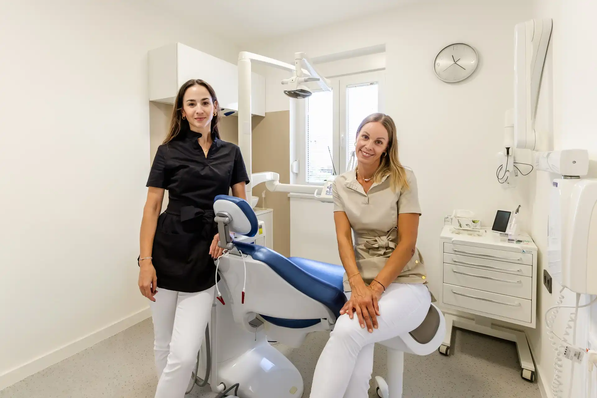 Dentists in the treatment room with dental equipment